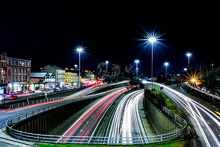 time lapse photography of highway during night time thumbnail