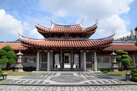 red and gray temple gate near concrete road thumbnail