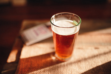 Pint of lager beer on table thumbnail