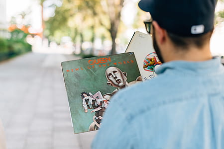 may looking at vinyl albums thumbnail
