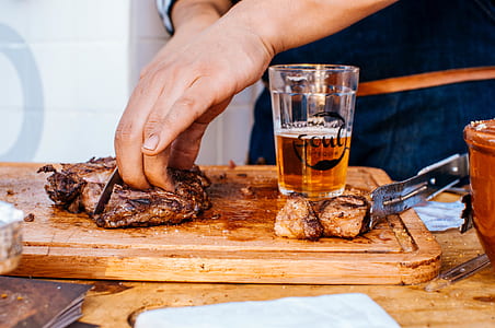 Person Slicing Grilled Meat thumbnail