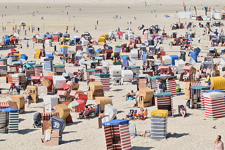 assorted tents on sand during daytime thumbnail