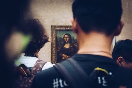 people looking Mona Lisa painting hanging on wall thumbnail