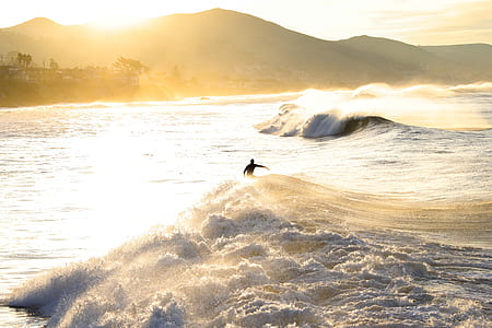 person surfing on sea waves thumbnail