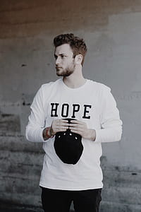 man holding cap thumbnail