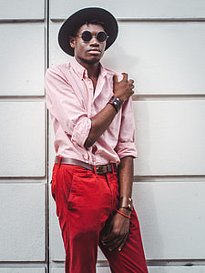 man in fedora hat, pink pinstripe dress shirt, and red denim bottoms outfit thumbnail