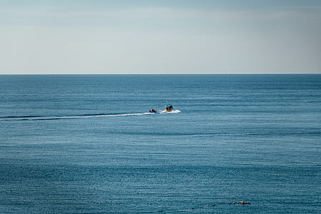 boat on body of water during daytime thumbnail