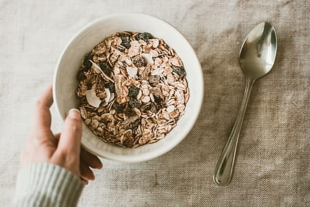 Person Holding Bowl Full of Oats thumbnail