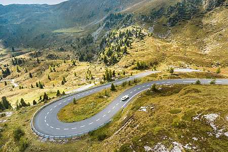 Vintage Car Running On a Fantastic Road in Pure Nature thumbnail