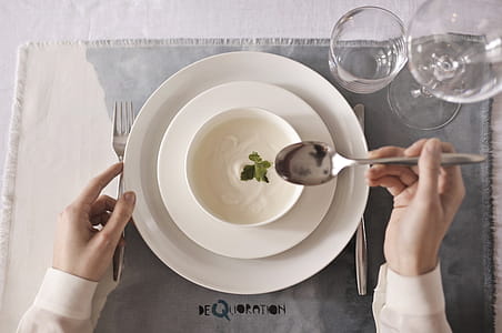 Person Wearing White Dress Shirt Holding Spoon thumbnail