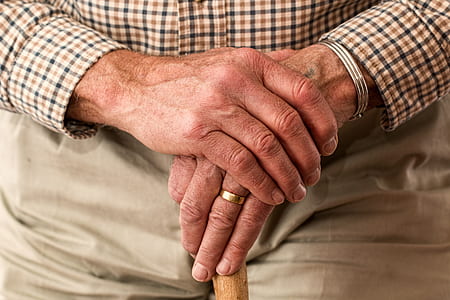 elderly man wearing dress shirt and wedding band ring thumbnail