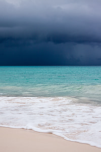 Blue and white clouds, blue seat and white sand thumbnail