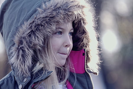 girl wearing grey and brown fur-lined hooded jacket closeup photography thumbnail