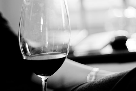 grayscale photo of clear glass long-stem wine glass thumbnail