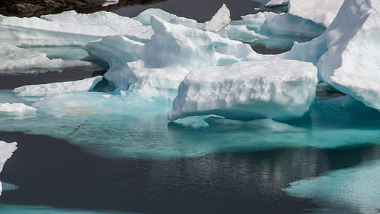 body of water surrounded with snow thumbnail