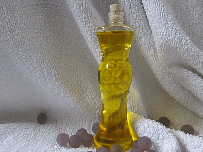 clear glass bottle on white fleece textile thumbnail