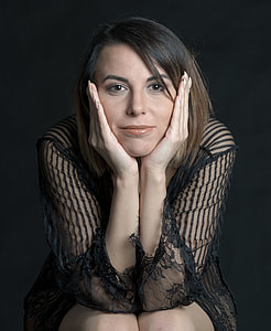 black haired woman wearing black sheer long-sleeved shirt thumbnail