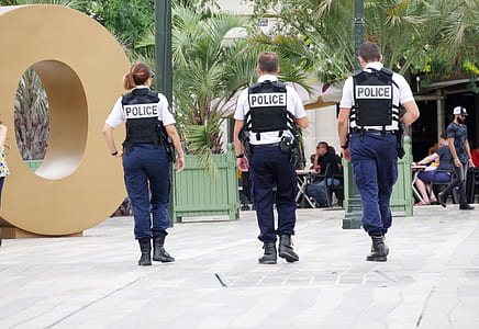 three police officers walking outdoor thumbnail