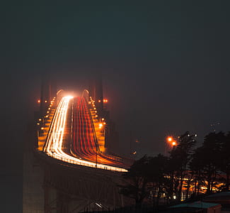 timelapse photography of bridge during nighttime thumbnail