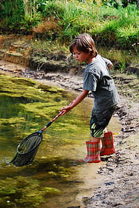 boy holding black and red net thumbnail