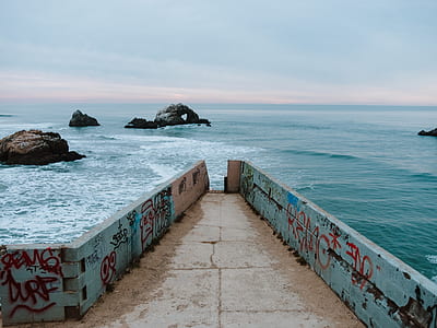 body of water near concrete building thumbnail