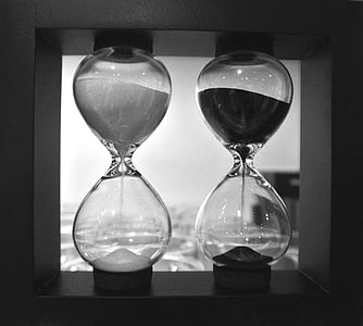 grayscale photo of two hourglasses thumbnail