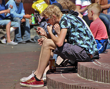 man sitting on concrete surface thumbnail