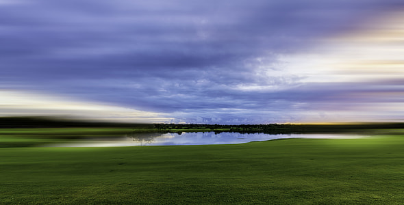 landscape photography of body of water with grass thumbnail