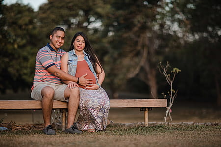 Man and Woman Sitting Beside Each Other thumbnail