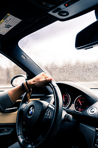 woman driving BMW car thumbnail