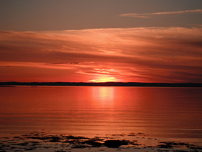 Red Sunset over the Seas in Quebec, Canada thumbnail