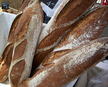 several baguette breads on a basket thumbnail