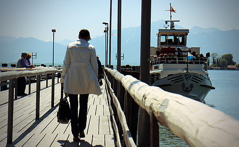 woman walking on dock bridge thumbnail