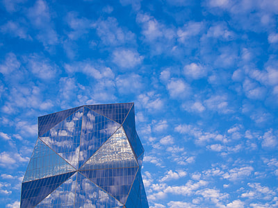 reflection photography of clouds on building thumbnail