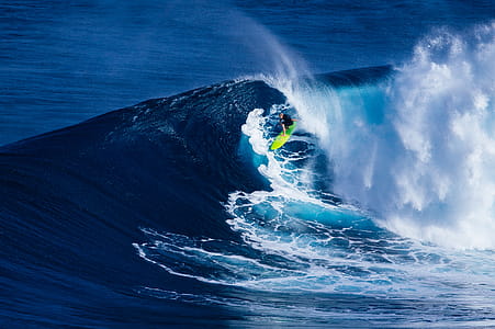 Pop of color, surfer riding a wave during daytime thumbnail