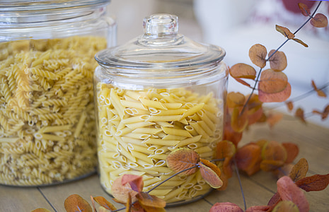 pasta in glass canister on brown wooden surface thumbnail