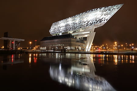 boat statuette on top of concrete bulding thumbnail