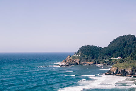 cliff coastline with calm sea at daytime thumbnail