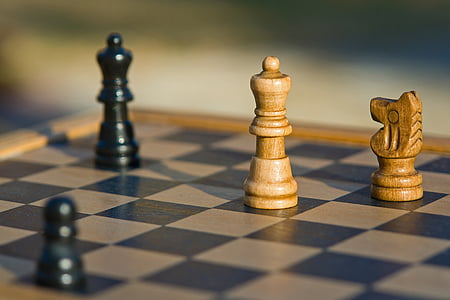 two black and brown chess pieces thumbnail