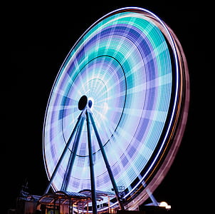 time-lapse photography of ferris wheel during night time thumbnail