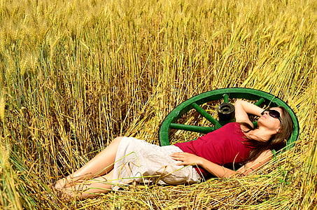 woman laying on a grass field thumbnail