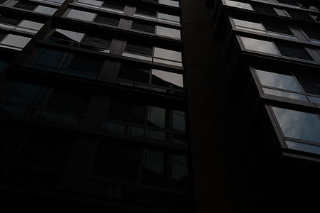 low angle photo of white and brown concrete building thumbnail