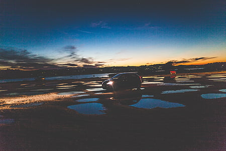 black vehicle under clear blue sky during dawn thumbnail