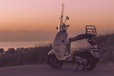 Moped bike captured at sunset thumbnail