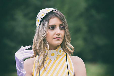 woman in sleeveless floral top and white glove focus photography thumbnail