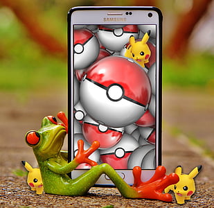 red-eyed tree frog hugging white Samsung Galaxy Note 4 with black case thumbnail