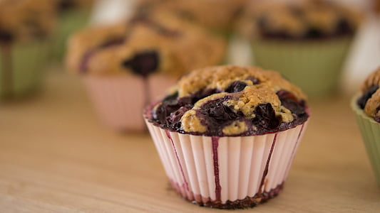 selective focus photography of muffin on beige table thumbnail