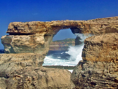 landscape photography of cliff near body of water thumbnail