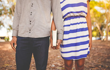 man and woman holding hands thumbnail