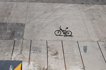 black full-suspension bike on concrete ground thumbnail